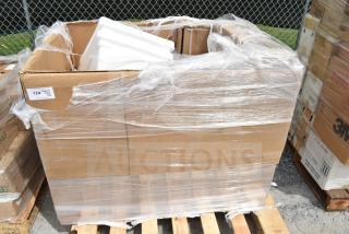 Cardboard box of 18 scratch and dent items, wrapped in plastic, including a work table and speed rail; auction lot 124.