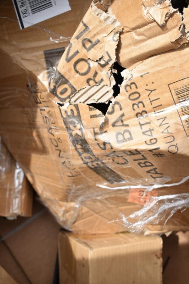 Cardboard boxes with visible tears and labels. Contains 18 new scratch and dent items, including work table and speed rail.