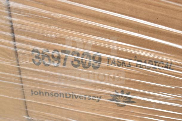 Plastic-wrapped box labeled "3697609 TASKI RADICAL" and "JohnsonDiversey," containing 50 new scratch and dent cleaners.