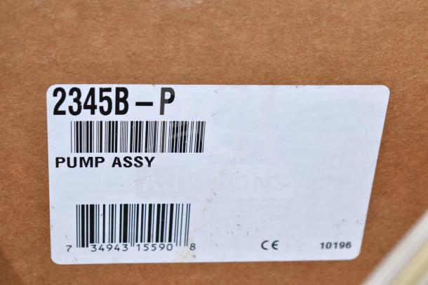 Cardboard box with label reading "2345B-P," "Pump Assy." Barcode below. Part of a scratch and dent auction lot.