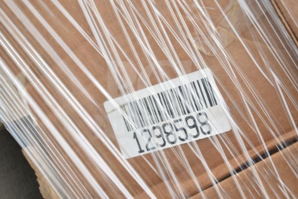 Cardboard box wrapped in plastic with barcode label showing number 1298598, indicating scratch and dent sale items.