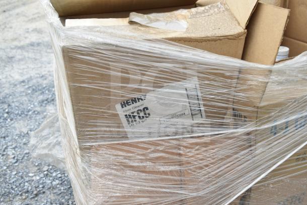 Plastic-wrapped pallet containing boxes labeled "Henry Floor Cleaner." Some boxes show signs of scratching and denting.