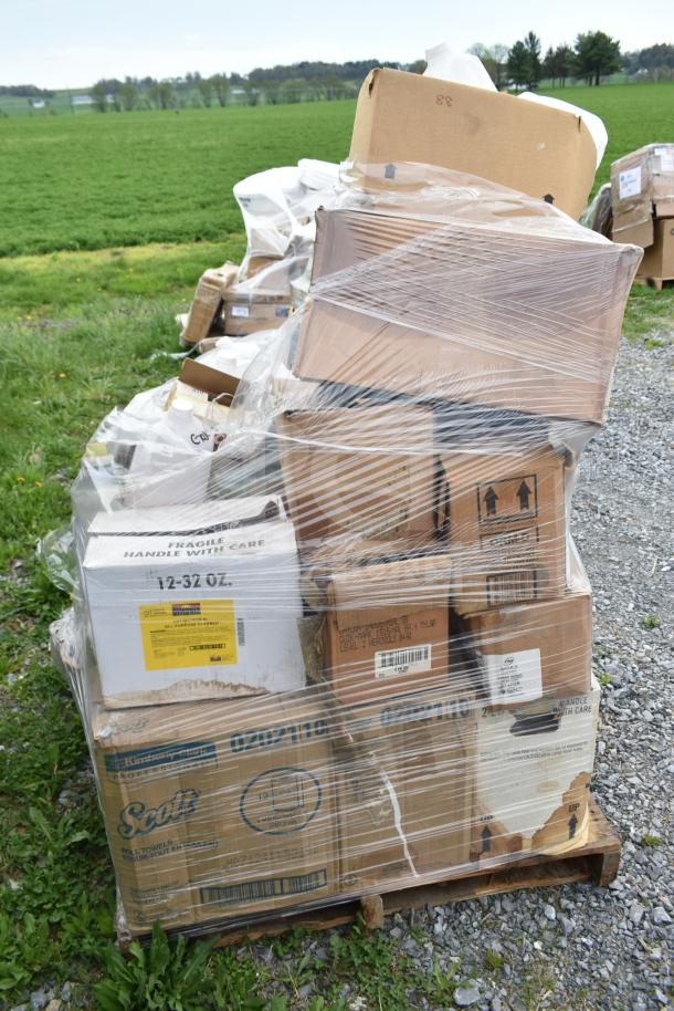 Pallet of 25 new, scratch and dent items, including cleaners and vinegar bottles, wrapped in plastic; labels indicate "Fragile" and "Handle with Care."