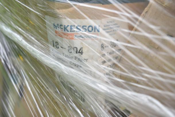 Plastic-wrapped McKesson Medi-Pak paper boxes, marked with product details. New scratch and dent auction items.