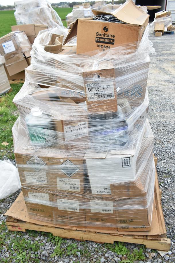 Pallet of 35 new scratch and dent boxes containing various cleaners. Visible labels include Sanitaire Commercial and Outpost. Wrapped in plastic.