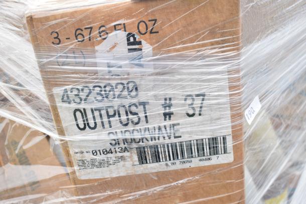 Pallet of 35 new scratch and dent cleaning products, labeled "OUTPOST #37 SHOCKWAVE," wrapped in plastic.