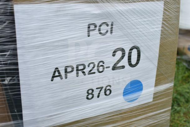 Packaging label with "PCI APR26-20 876" on wrapped item, possibly for auction containing assorted new items.