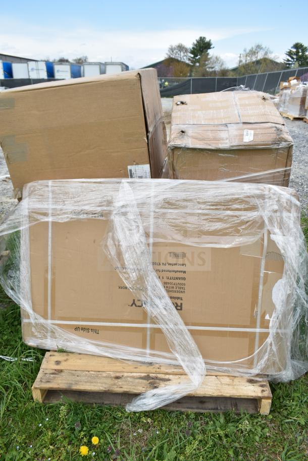 Sealed cardboard boxes on a pallet, labeled "Bakery Display Case," wrapped in plastic, part of a scratch and dent auction.