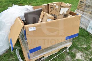 Mixed palette of scratch and dent items including a sofa, boxes of pans, and more. Visible tags indicate lot number 132.