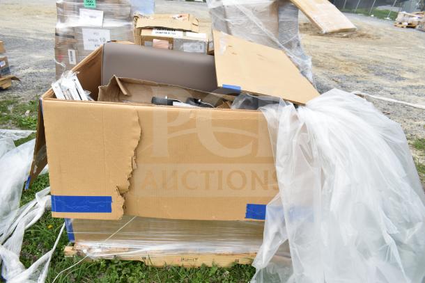 Cardboard box containing new scratch and dent items, including a sofa and pans. Visible damage to box; items intact inside.