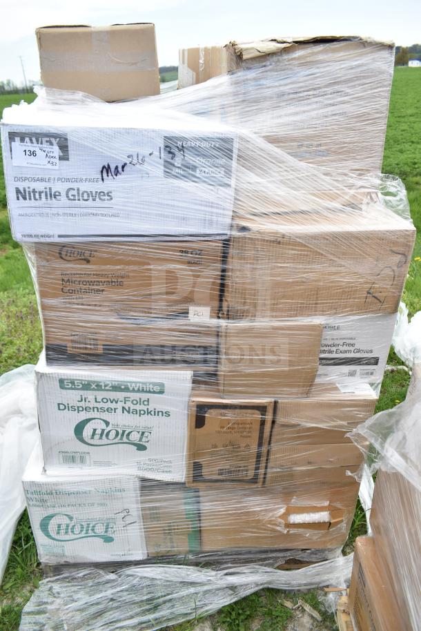 Stack of 32 boxes including plates, napkins, gloves, and take-out containers, visibly wrapped in plastic, labeled as scratch and dent.