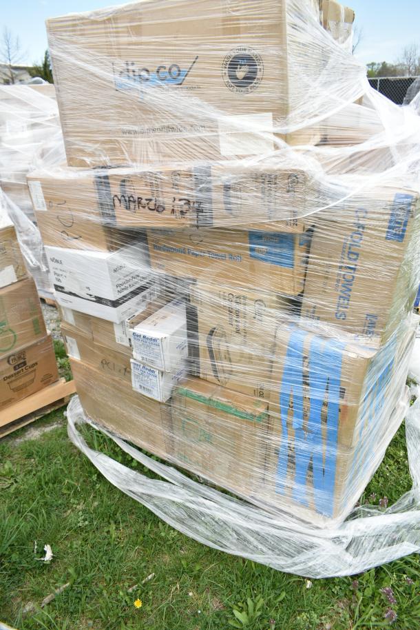Plastic-wrapped pallet with mixed brand new items including plates, napkins, gloves, and containers. Boxes labeled "MAR26-134".