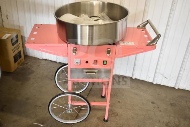 BRAND NEW SCRATCH AND DENT Carnival King 382CCM21CT cotton candy machine with 21" stainless steel bowl and pink cart. 110V.