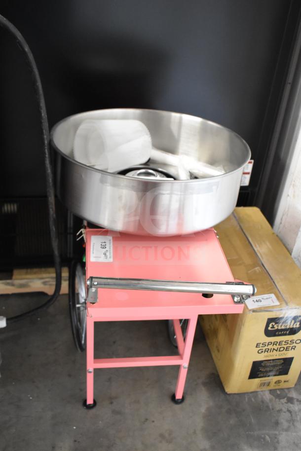 Brand new 2024 Carnival King 382CCM21CT cotton candy machine with 21" stainless steel bowl, pink cart. 110V, 1 phase.