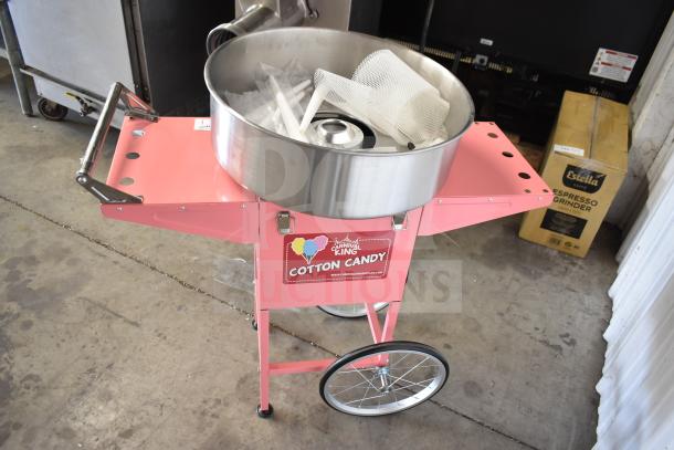 Brand new 2024 Carnival King 382CCM21CT cotton candy machine with 21" stainless steel bowl and pink cart, 110 volts.