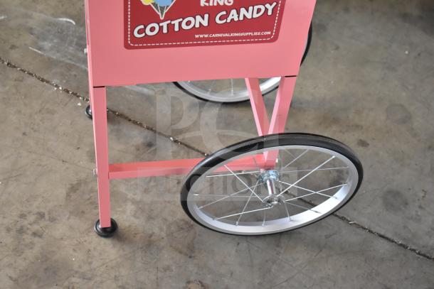 Carnival King 2024 Cotton Candy Machine, model 382CCM21CT, stainless steel bowl, pink cart, new condition, visible logo.