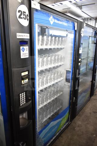 Crane 5800-4 commercial vending machine with bill acceptor, minor glass damage, operates at 115 volts, 1 phase.