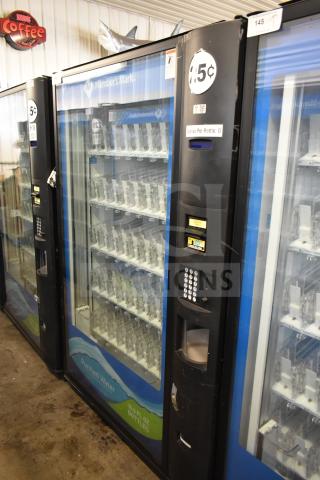 Crane 5800-4 commercial drink vending machine with bill acceptor, 115 volts, 1 phase, in good condition, featuring labeled pricing and selection buttons.