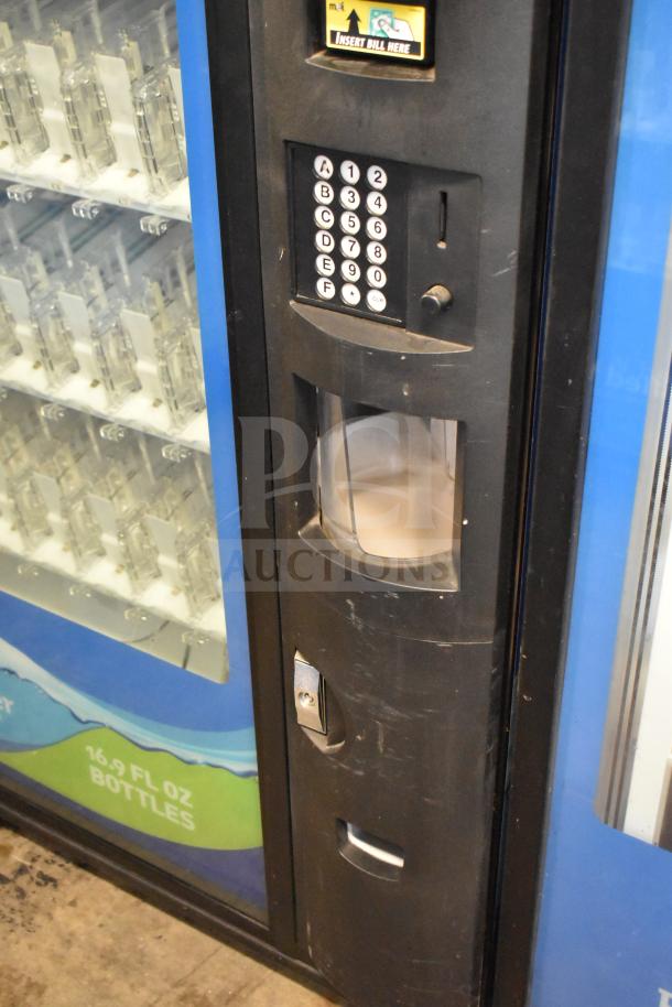 Crane 5800-4 vending machine with bill acceptor, 115V, 1 phase. Black exterior, visible drink slots, keypad interface.