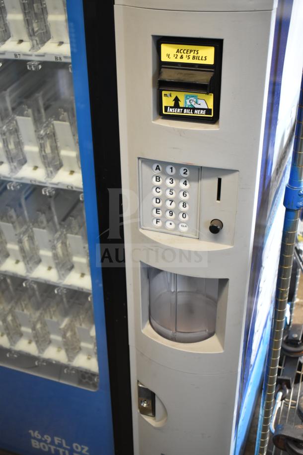 Crane 5800-4 vending machine with bill acceptor, keypad, and button. Accepts $1, $2, $5 bills. 115 volts, 1 phase.