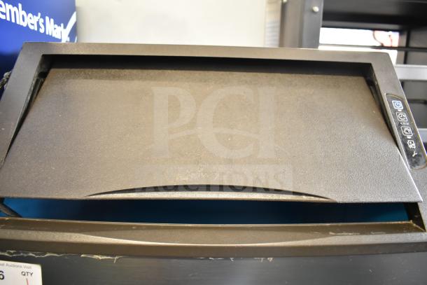 Manitowoc UYF0140A-161B ice machine, self-contained, commercial use, 115 volts, visible control panel, clean condition.