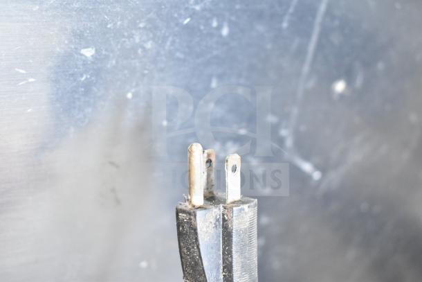 Alt text: Plug of Hobart 84145 Buffalo Chopper, 115 volts, showing prongs and slight wear.
