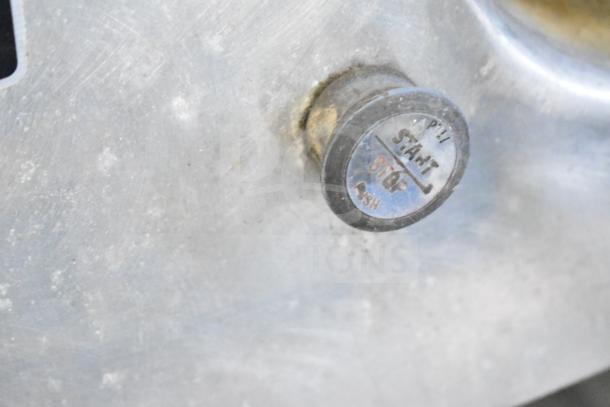 Hobart 84145 Buffalo Chopper detail showing start/stop button. Features commercial-grade stainless steel with visible wear.