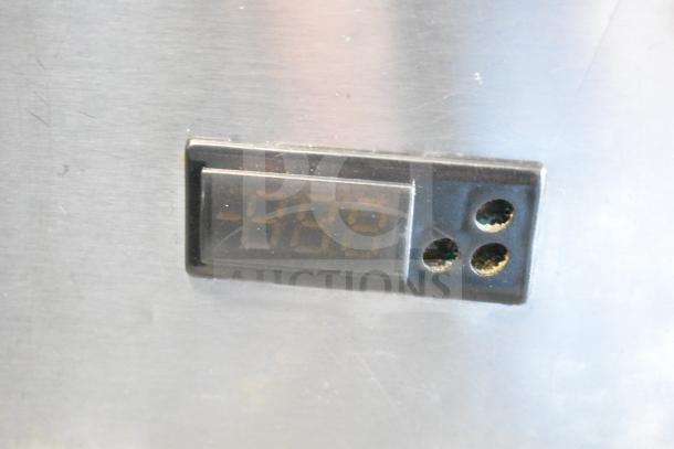 Commercial chef base with a digital display, metal finish, four drawers, on commercial casters, operates at 115 volts, 1 phase.