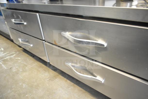 Commercial 4 Drawer Chef Base on casters, stainless steel, 115 volts, 1 phase, with signs of use.