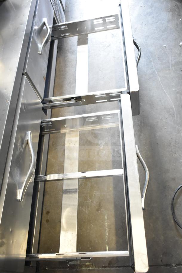 Commercial 4 Drawer Chef Base on casters with stainless steel construction. Features 115 volts, 1 phase power supply.