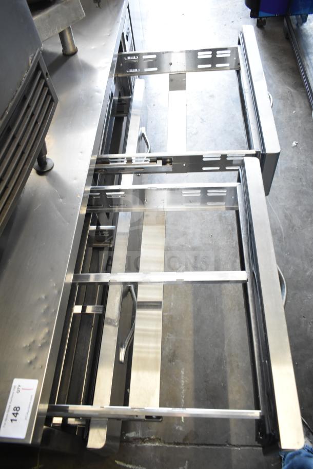 Commercial 4-drawer chef base on casters, stainless steel, 115 volts, 1 phase, sturdy and functional.