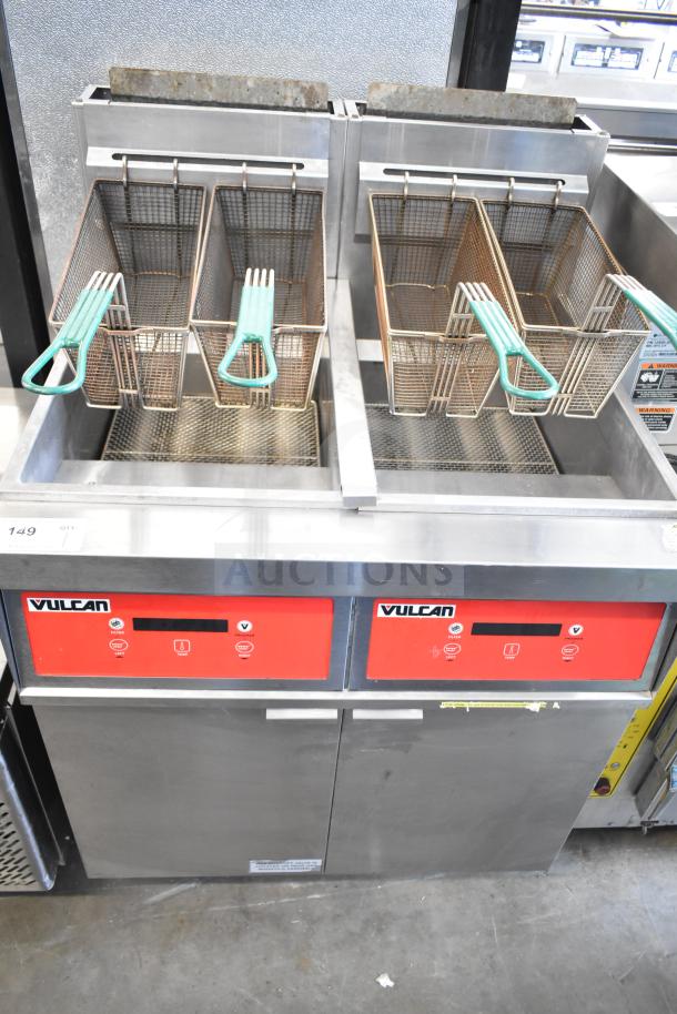 Vulcan commercial 2 bay deep fat fryer with fry baskets, on casters. Features stainless steel finish and red control panels.