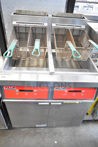 Vulcan commercial 2 bay deep fat fryer with fry baskets, on casters. Features stainless steel finish and red control panels.
