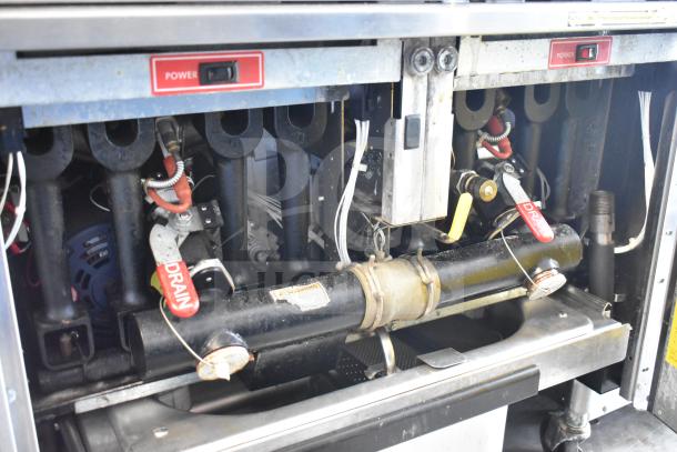 Vulcan commercial 2-bay deep fat fryer, floor style, with fry baskets, on casters. Visible "Power" and "Drain" labels.