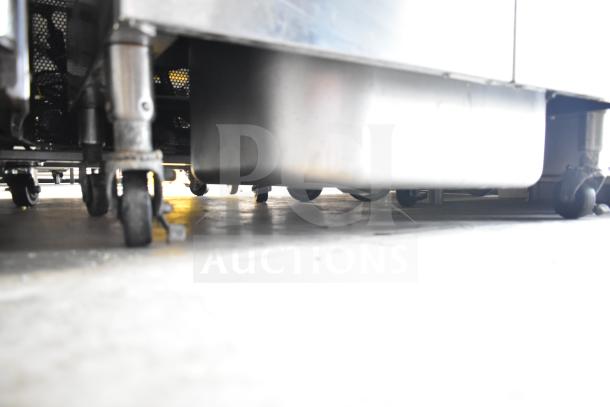 Vulcan commercial deep fat fryer on casters, 2 bay, with fry baskets, stainless steel, used condition.