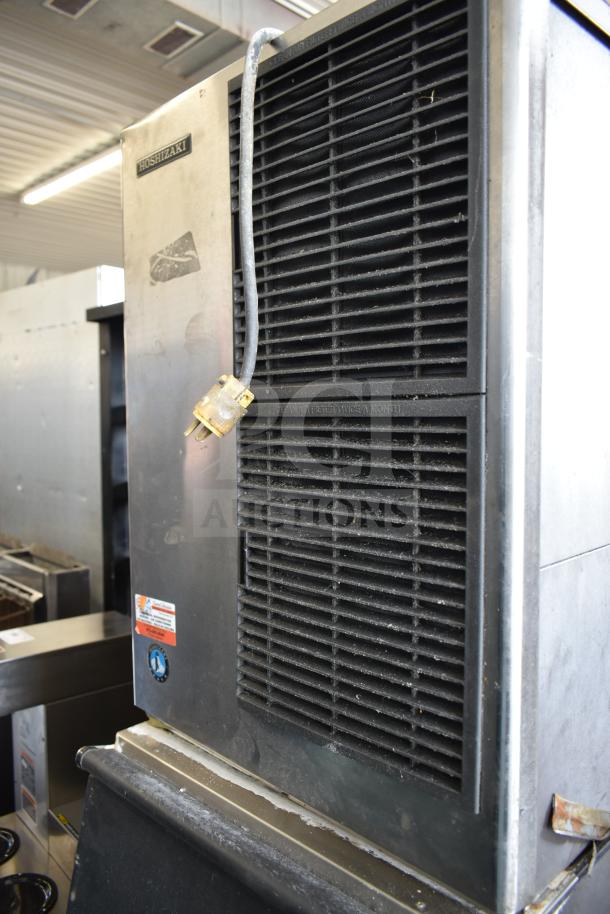 Hoshizaki KM-515MAJ commercial ice head on bin, 115 volts, 1 phase, visible labels, sturdy design for reliable ice production.