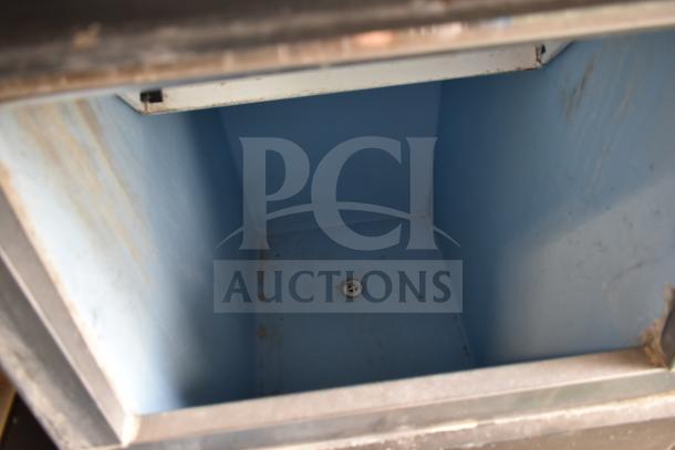 Hoshizaki KM-515MAJ commercial ice head on ice bin, 115 volts, 1 phase, interior view showing clean blue lining.
