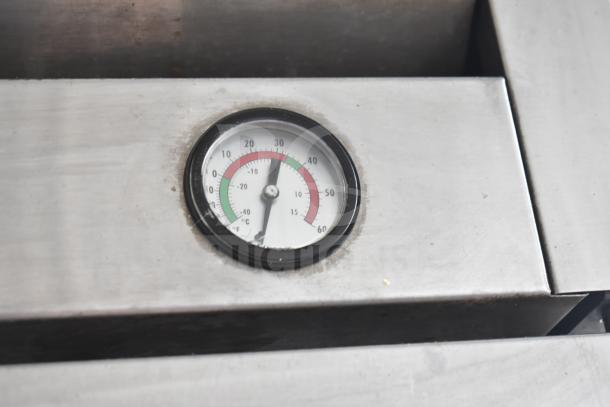 True T-23-2 commercial cooler thermometer gauge, showing cold temperature range. Durable stainless steel surface.