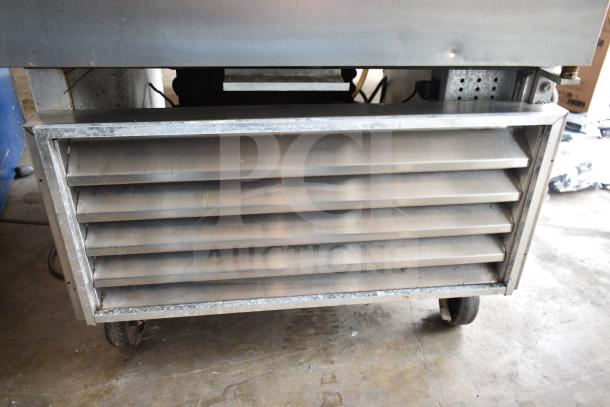 True T-23-2 commercial cooler on casters, vent view. 115V, 1-phase. Shows light wear, making it ideal for businesses.