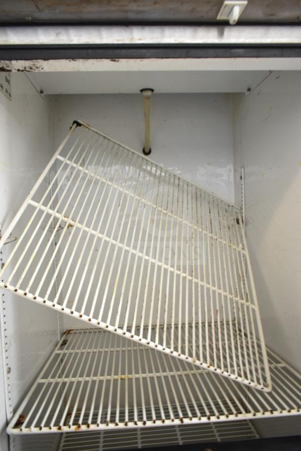 True T-23-2 Cooler with two half-size reach-in doors, commercial casters, and wire shelves. 115 volts, 1 phase.