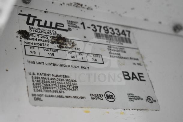 Label on True T-23-2 commercial cooler. Shows model details, 115V, 1 phase, NSF and UL listed, energy-saving specs.