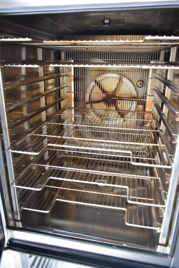 2022 Vulcan V1PJ102G-81 commercial gas combi oven with pan rack, clean interior, stainless steel construction, auction item.