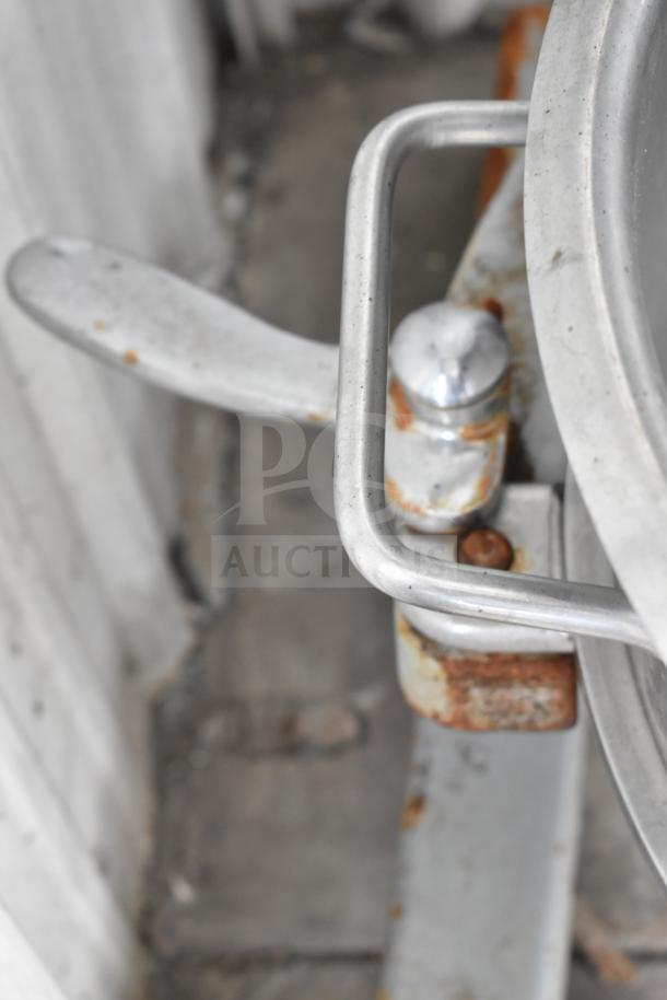 Spar 30HI-J 30 Quart mixer detail showing a metal lever and handle. Signs of wear and rust visible.