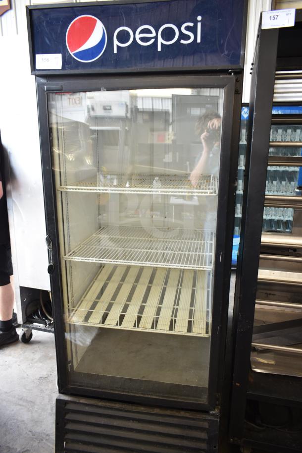 QBD DC26HB Commercial Single Door Cooler Merchandiser, Pepsi branding, shelves visible, 115V, 1 phase, used condition.