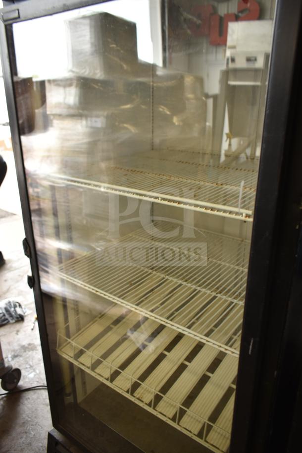 QBD DC26HB Commercial Single Door Reach In Cooler, 115 Volts, visible shelves, clean glass front, used condition.