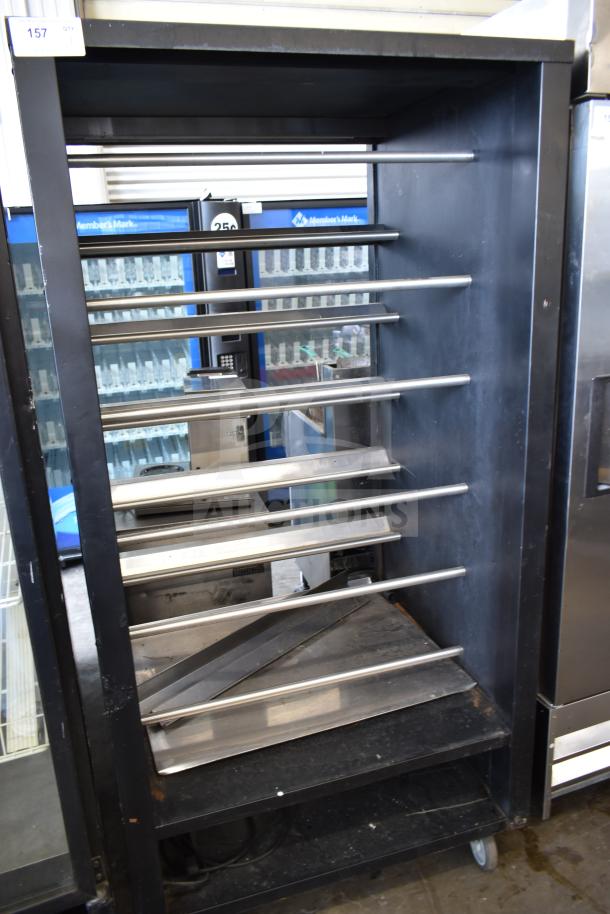 Vulcan 1013776 pastry merchandiser, commercial floor model, steel shelves, on casters, moderate wear.