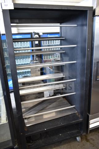 Vulcan 1013776 pastry merchandiser, commercial floor model, steel shelves, on casters, moderate wear.