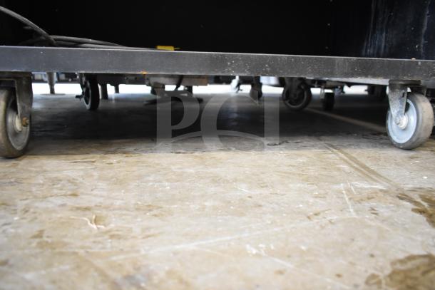 Vulcan 1013776 bakery merchandiser on sturdy commercial casters, showcasing mobility and industrial design.