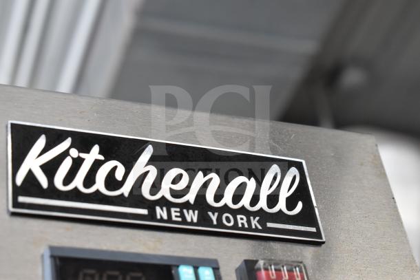 Coldline C-1FE single door reach-in freezer with pan rack, commercial casters, 115 volts, 1 phase, Kitchenall label visible.