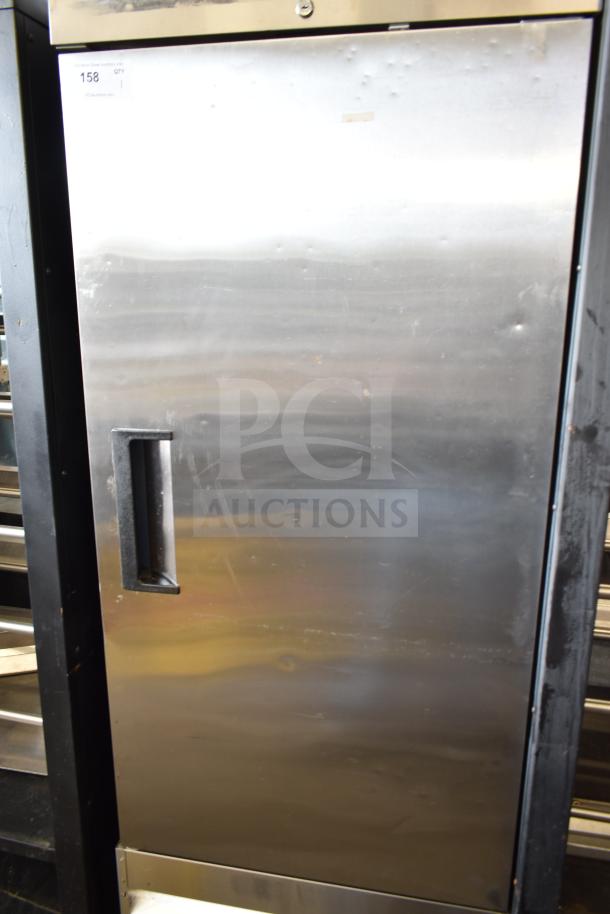 Coldline C-1FE commercial freezer, single door with pan rack, mounted on casters. Stainless steel exterior, tags visible.